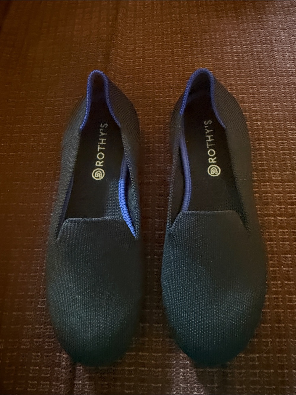 Rothy's  Black Knit Slip-Ons with Blue Trim